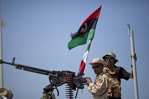 Libya’s Gadhafi pledges he won’t leave